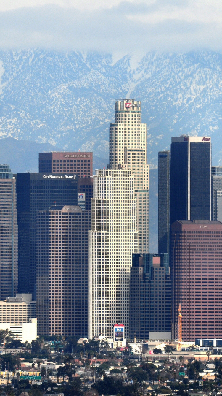High Rise Buildings Near Mountain During Daytime. Wallpaper in 750x1334 Resolution