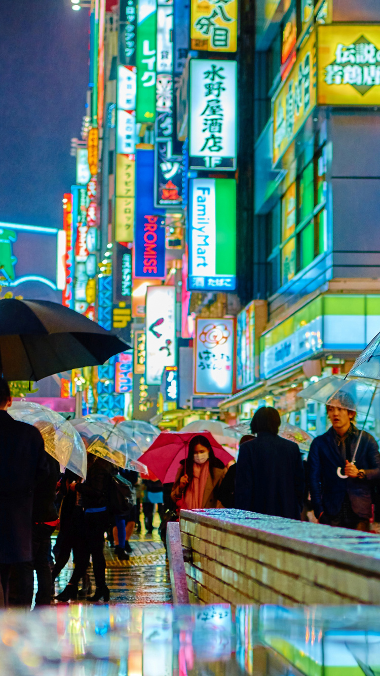 People Walking on Street During Night Time. Wallpaper in 750x1334 Resolution