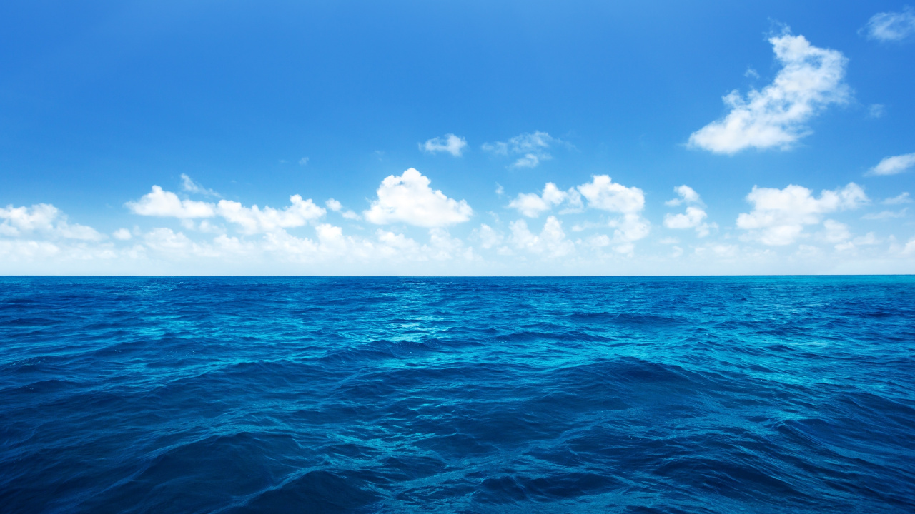 Blue Ocean Under Blue Sky and White Clouds During Daytime. Wallpaper in 1280x720 Resolution
