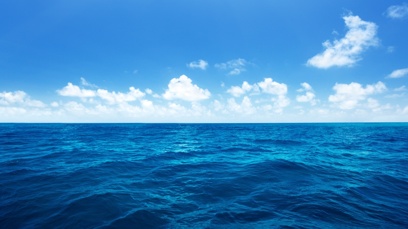Blue Ocean Under Blue Sky and White Clouds During Daytime. Wallpaper in 1366x768 Resolution