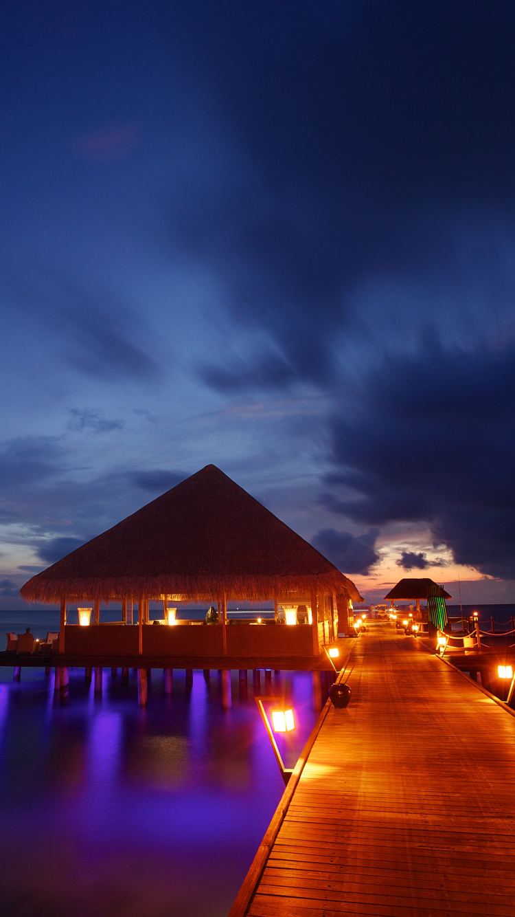 Brown Wooden House on Dock During Night Time. Wallpaper in 750x1334 Resolution