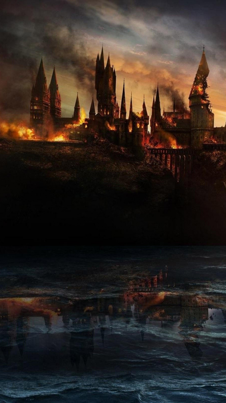 Castle on Top of Mountain Near Body of Water. Wallpaper in 750x1334 Resolution