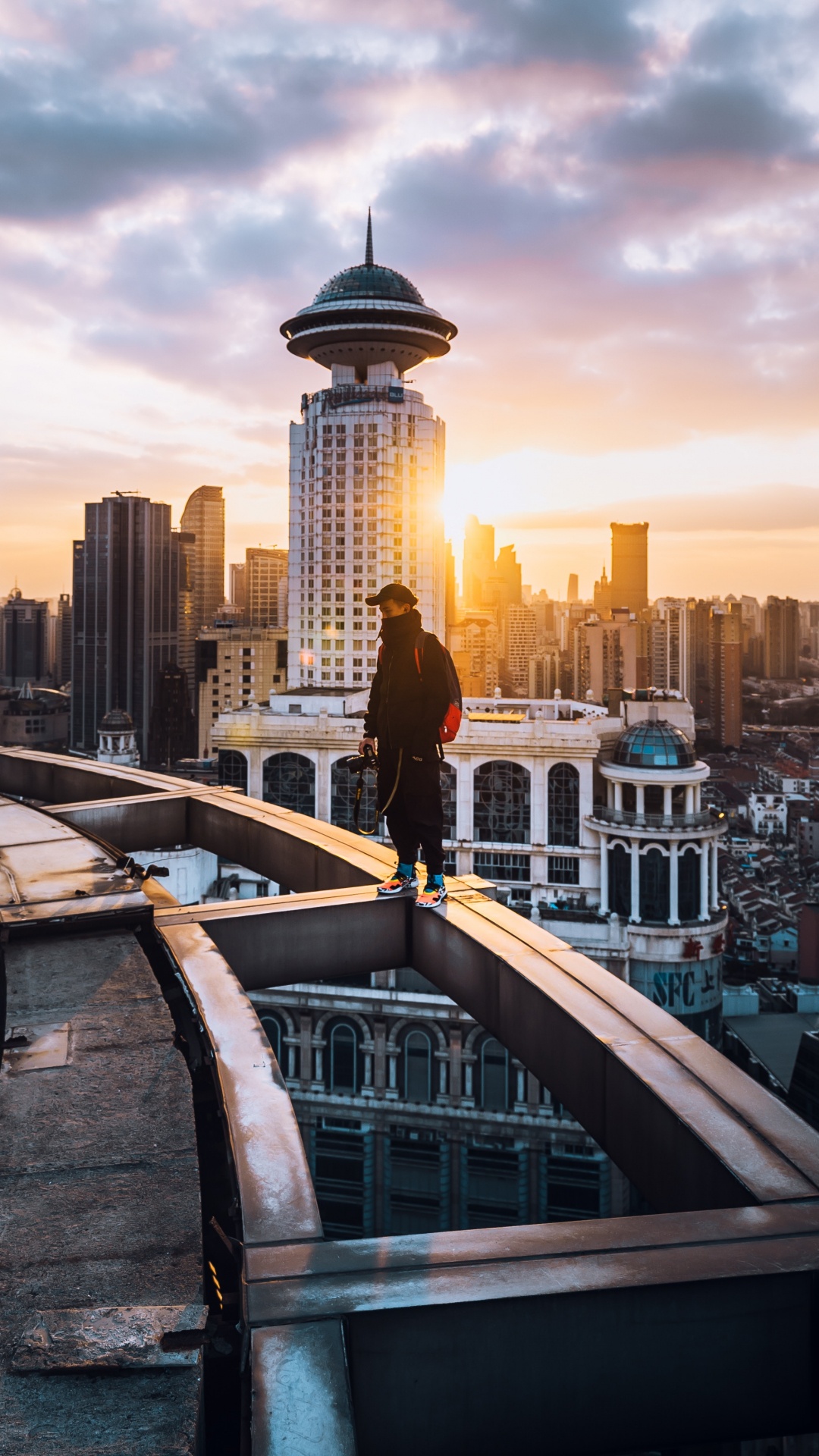 People Walking on Bridge Near City Buildings During Daytime. Wallpaper in 1080x1920 Resolution