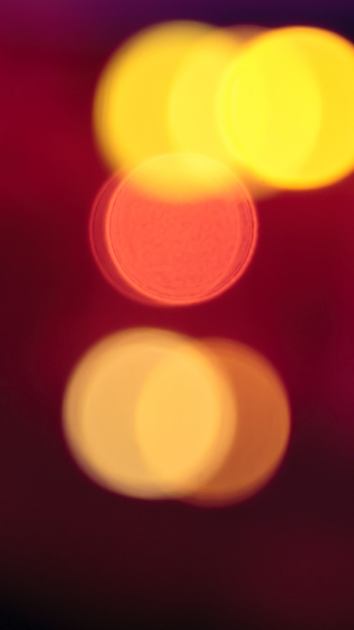 Red and Yellow Bokeh Lights. Wallpaper in 720x1280 Resolution