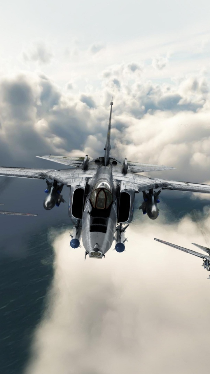 Fighter Plane Flying Over The Sea During Daytime. Wallpaper in 720x1280 Resolution