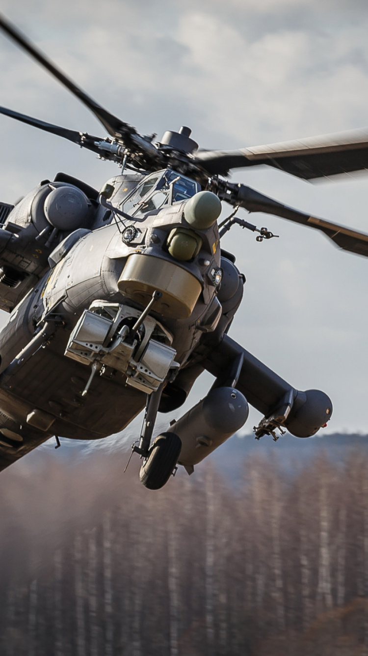 Schwarzer Und Grauer Hubschrauber, Der Tagsüber Über Grüne Bäume Fliegt. Wallpaper in 750x1334 Resolution