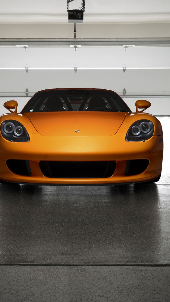 Orange Ferrari 458 Italia Parked in a White Room. Wallpaper in 720x1280 Resolution