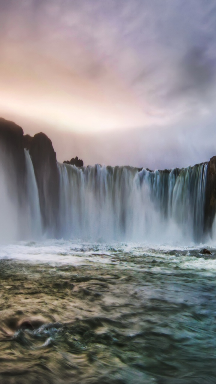 Water Falls Under Cloudy Sky. Wallpaper in 720x1280 Resolution