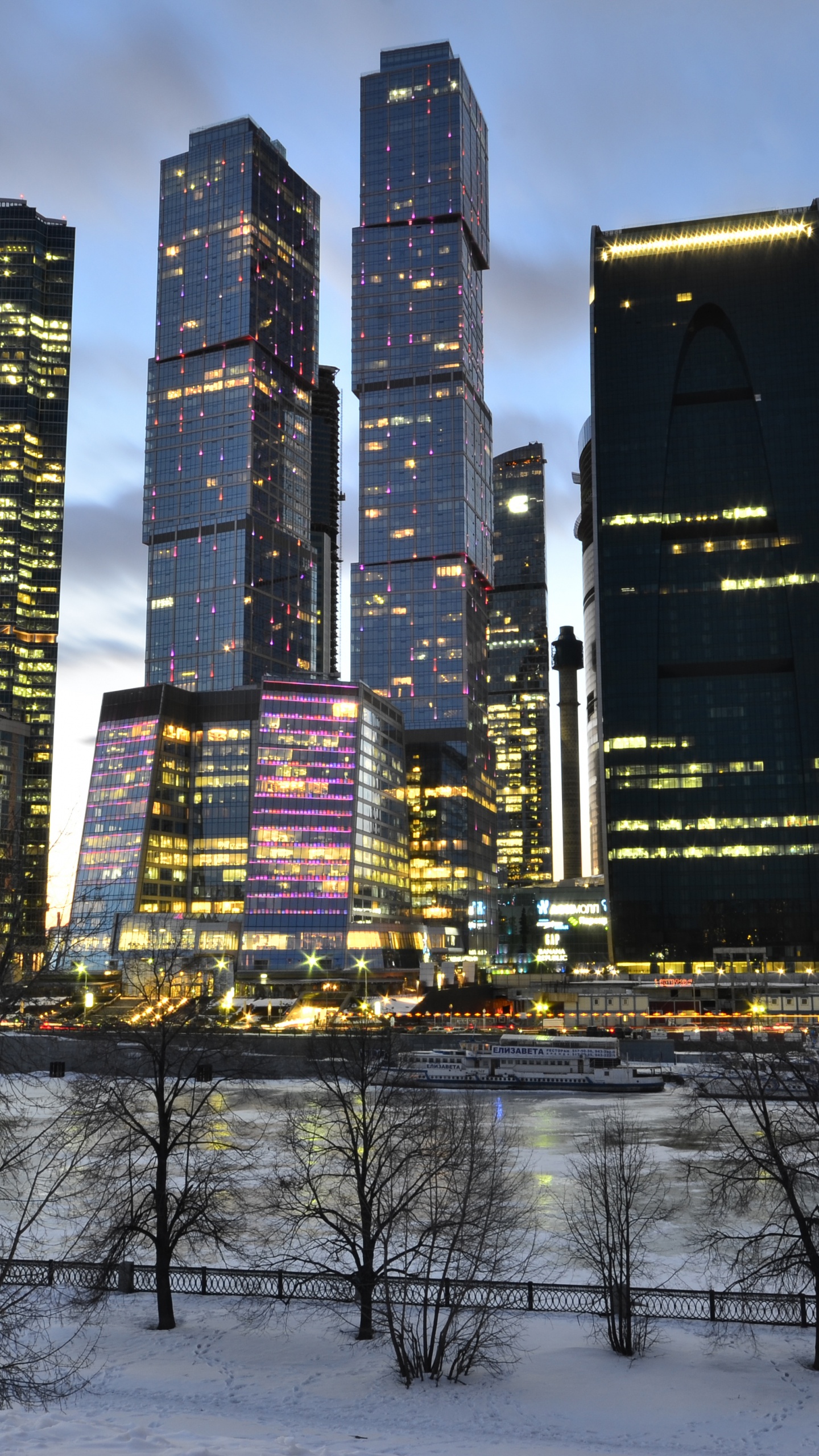 City Buildings Under Blue Sky During Night Time. Wallpaper in 1440x2560 Resolution