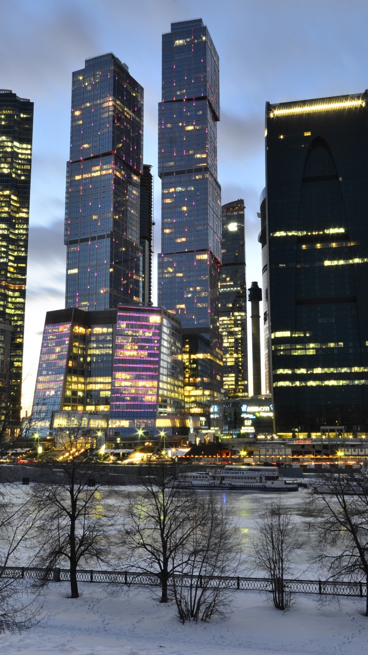 City Buildings Under Blue Sky During Night Time. Wallpaper in 720x1280 Resolution