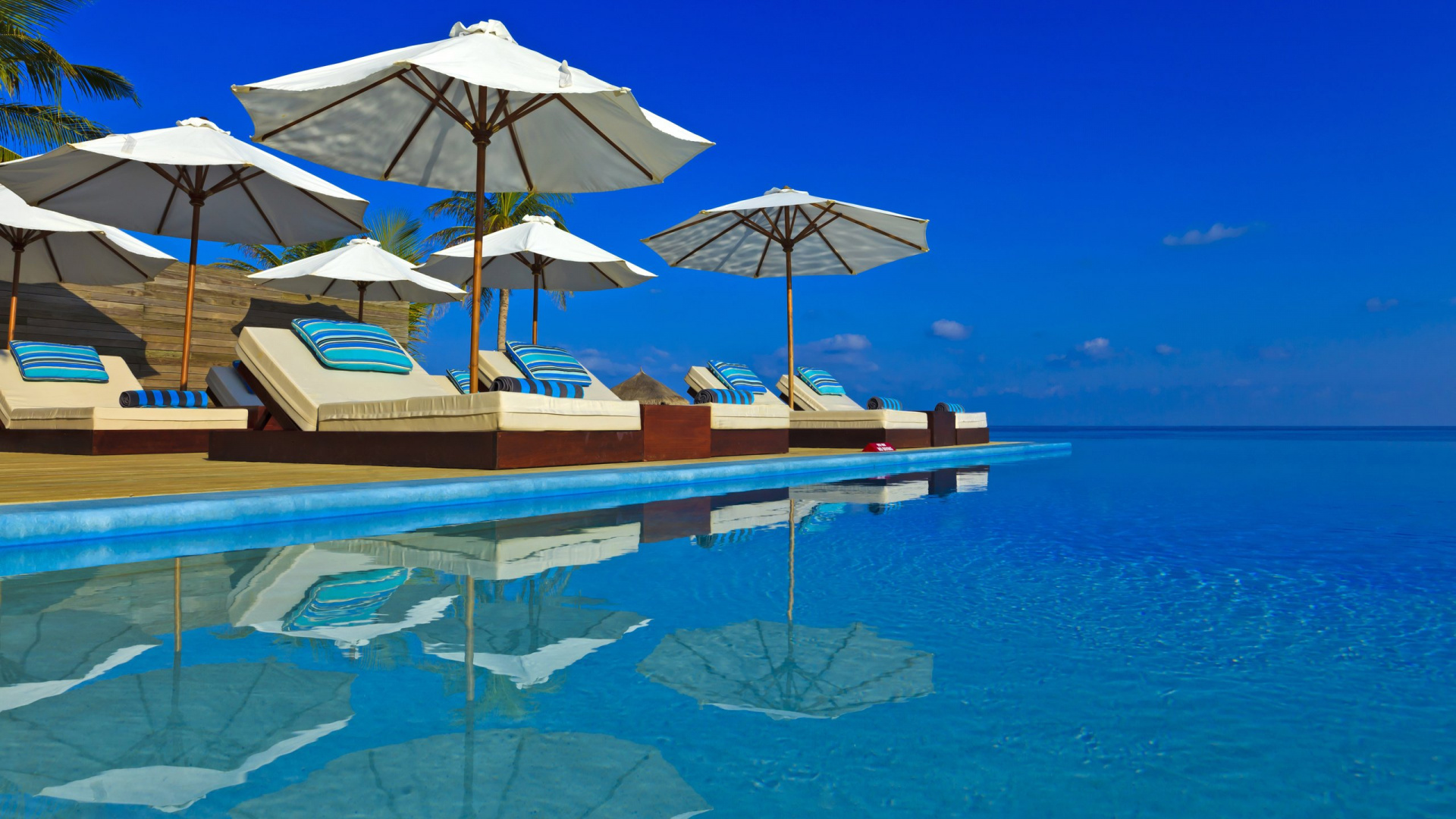 Brown and White Umbrella on Blue Water. Wallpaper in 1920x1080 Resolution