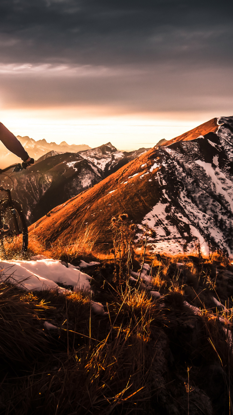 Man in Green Jacket and Black Pants Riding on Black Motorcycle on Brown Grass Field During. Wallpaper in 750x1334 Resolution