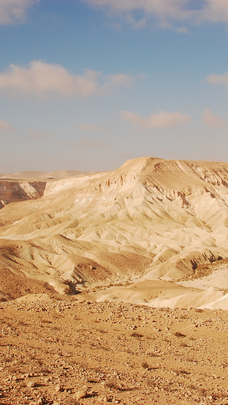Brown Mountain Under Blue Sky During Daytime. Wallpaper in 750x1334 Resolution