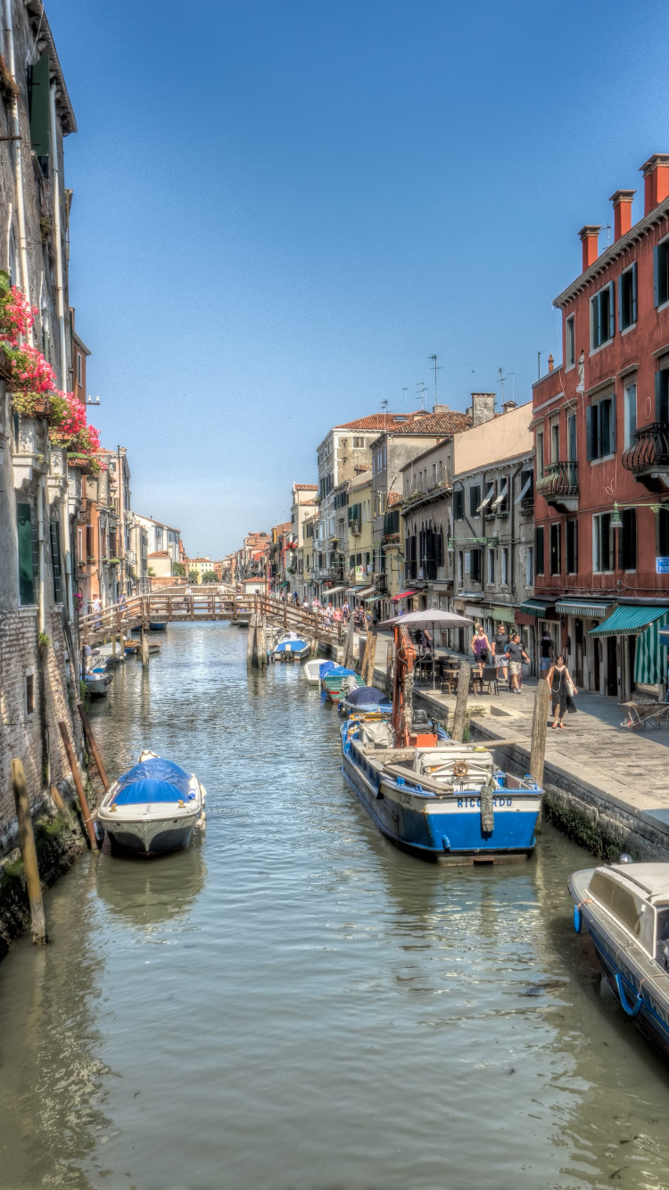 Blue and White Boat on River Between Buildings During Daytime. Wallpaper in 750x1334 Resolution