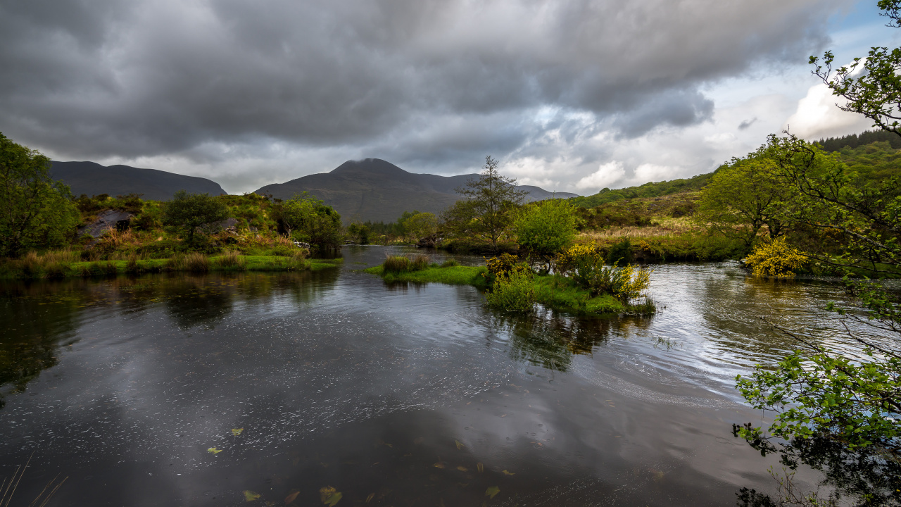 Green Trees Beside River Under Cloudy Sky During Daytime. Wallpaper in 1280x720 Resolution