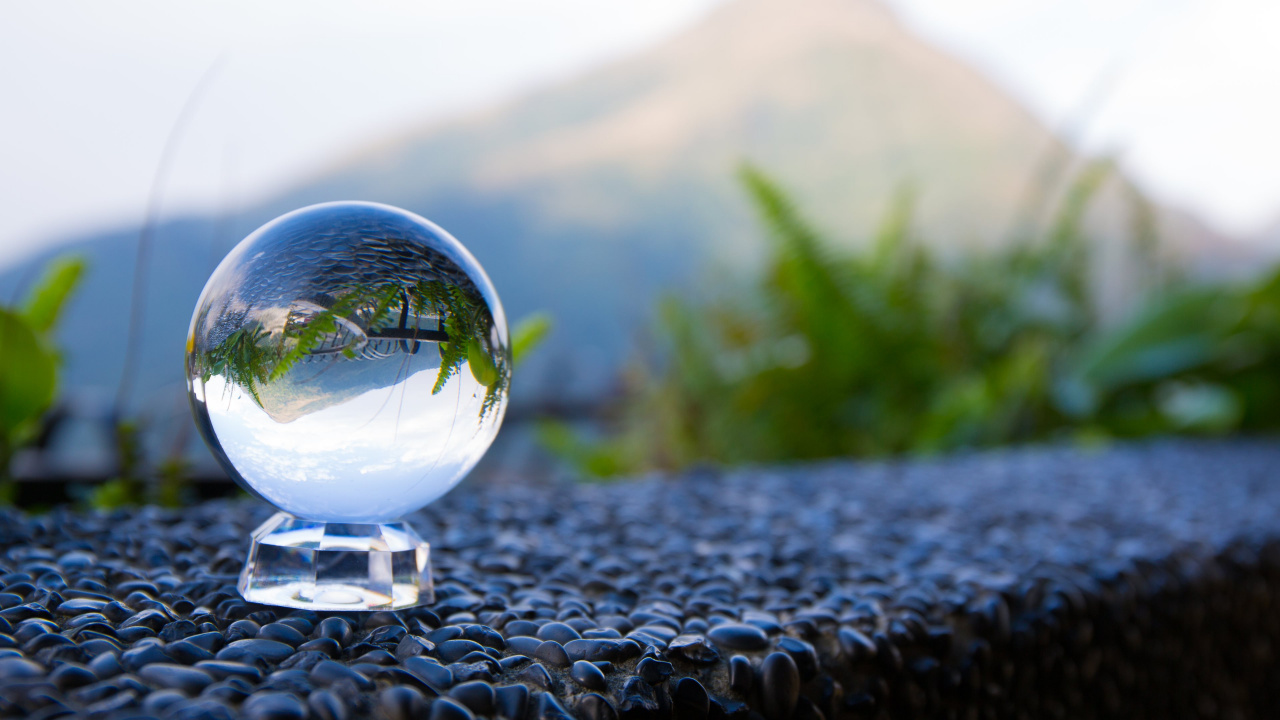 Clear Glass Ball on Black and White Stone. Wallpaper in 1280x720 Resolution