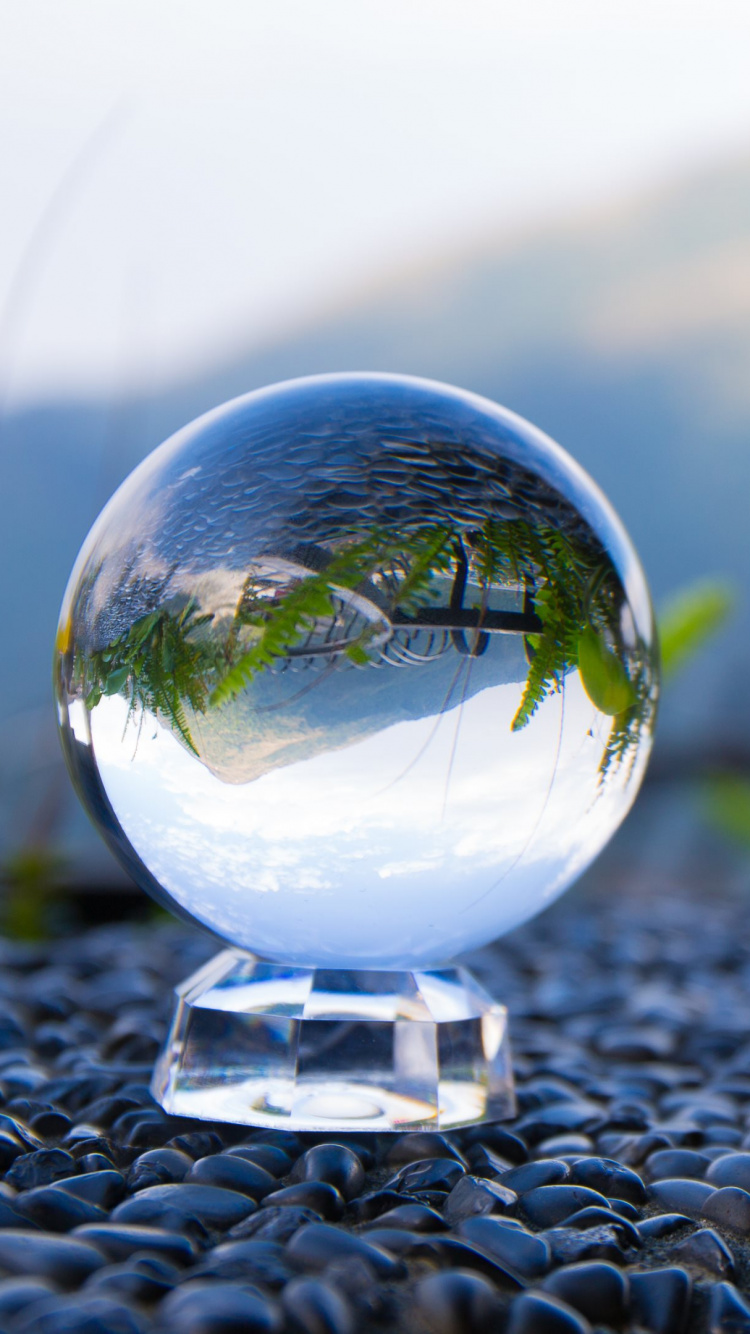 Clear Glass Ball on Black and White Stone. Wallpaper in 750x1334 Resolution