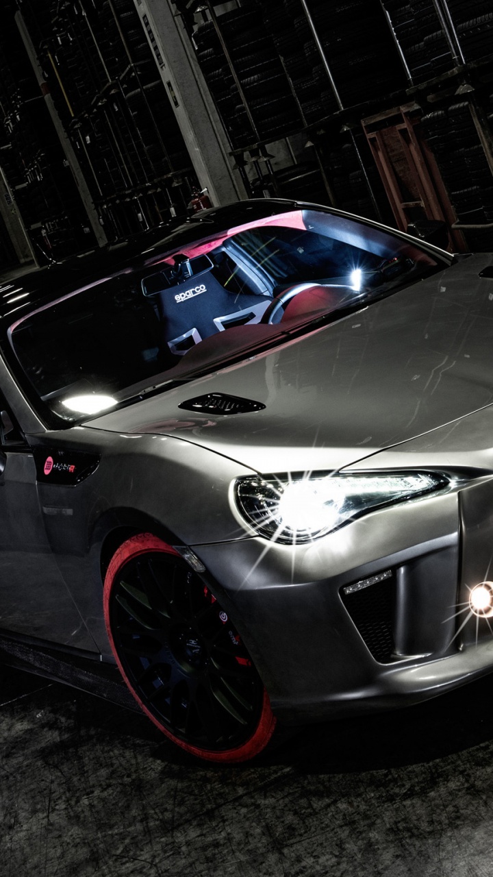 Black Porsche 911 Parked in Garage. Wallpaper in 720x1280 Resolution