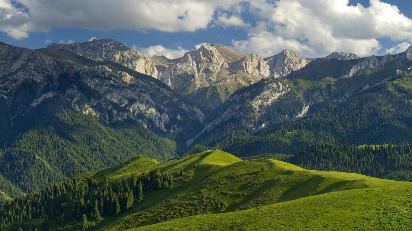 Green and White Mountains Under White Clouds During Daytime. Wallpaper in 1366x768 Resolution