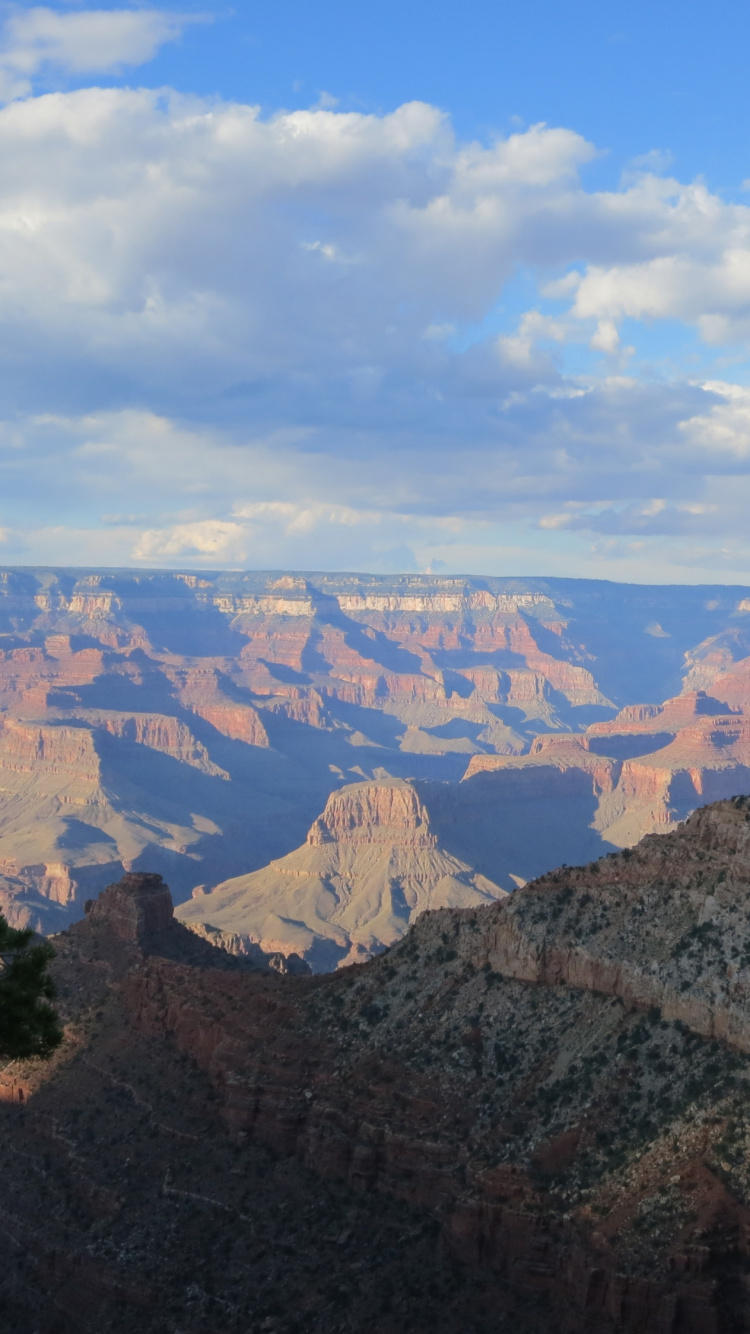 Brown and Gray Mountains Under White Clouds and Blue Sky During Daytime. Wallpaper in 750x1334 Resolution