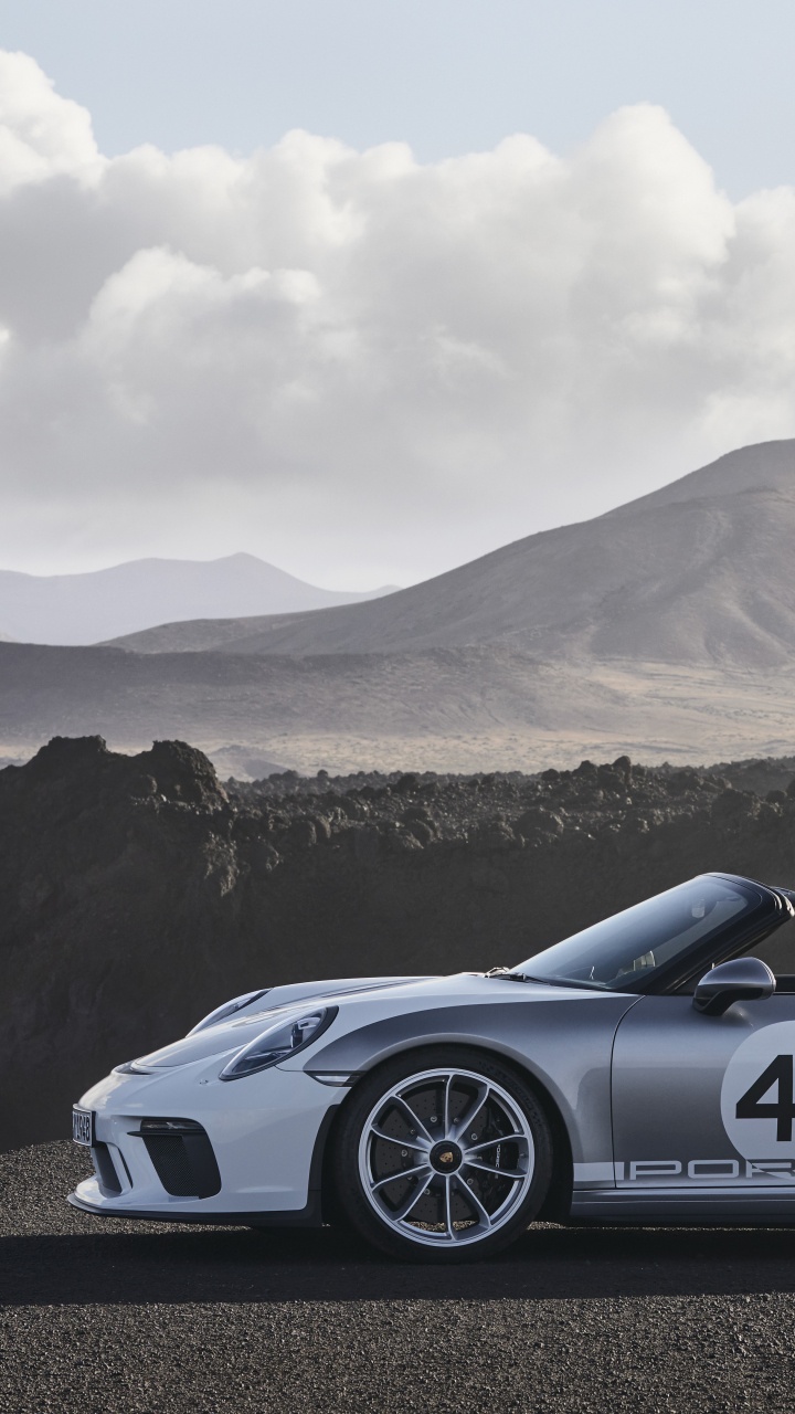 Black Porsche 911 on Road Near Mountain During Daytime. Wallpaper in 720x1280 Resolution