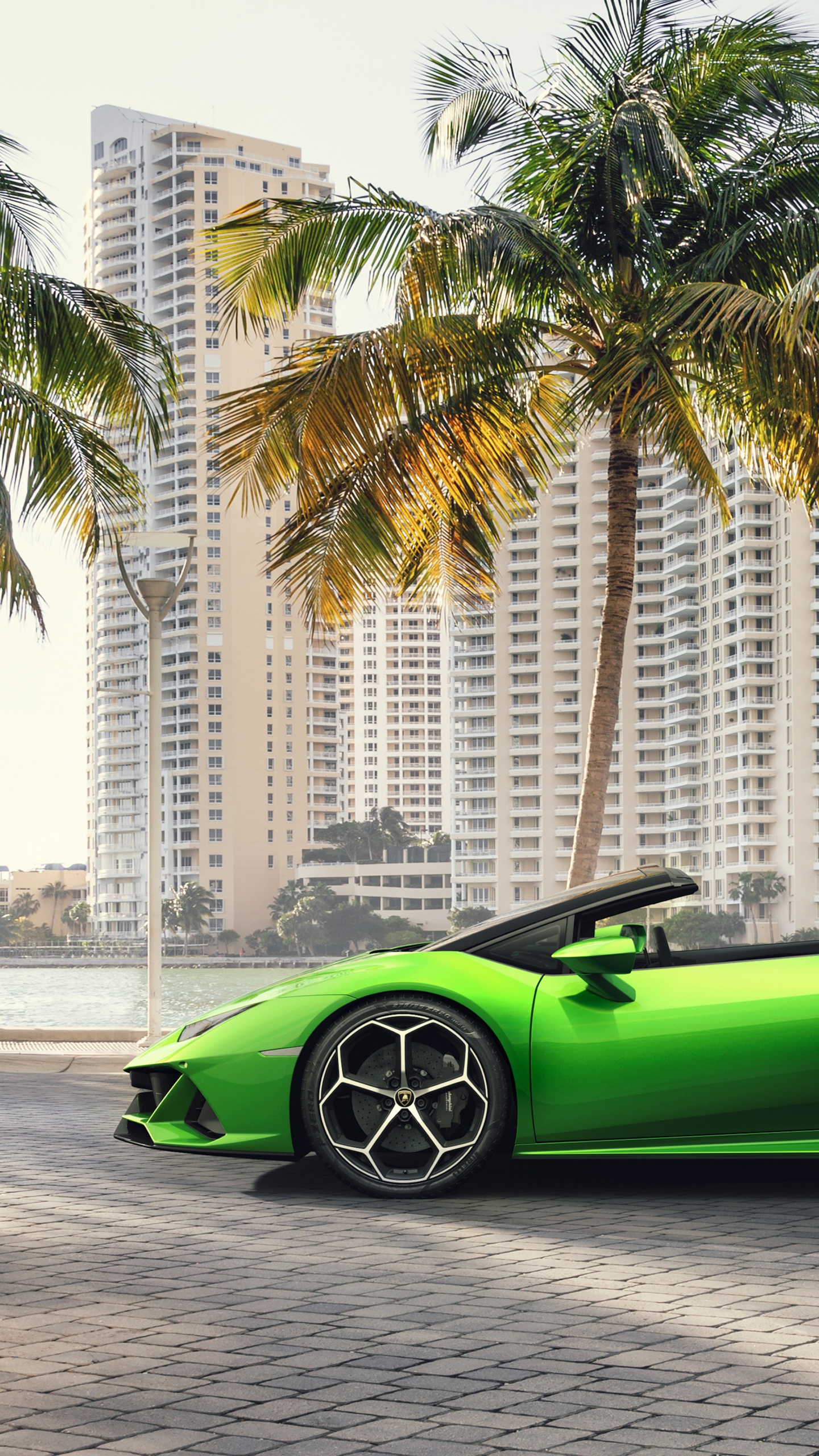 Green Ferrari Sports Car on Road During Daytime. Wallpaper in 1440x2560 Resolution