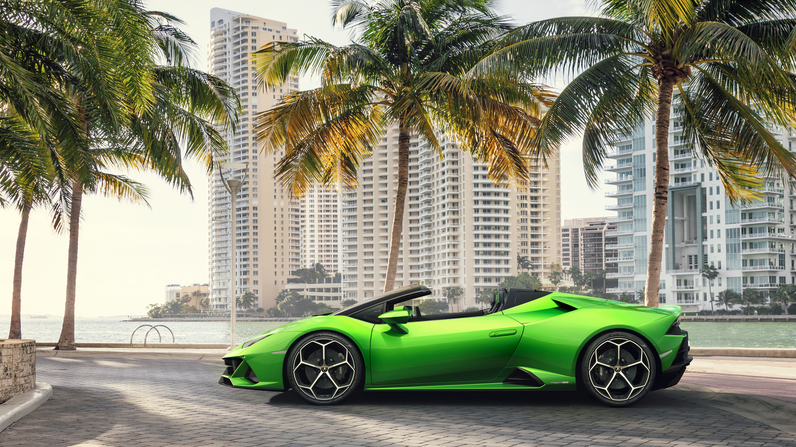 Green Ferrari Sports Car on Road During Daytime. Wallpaper in 2560x1440 Resolution