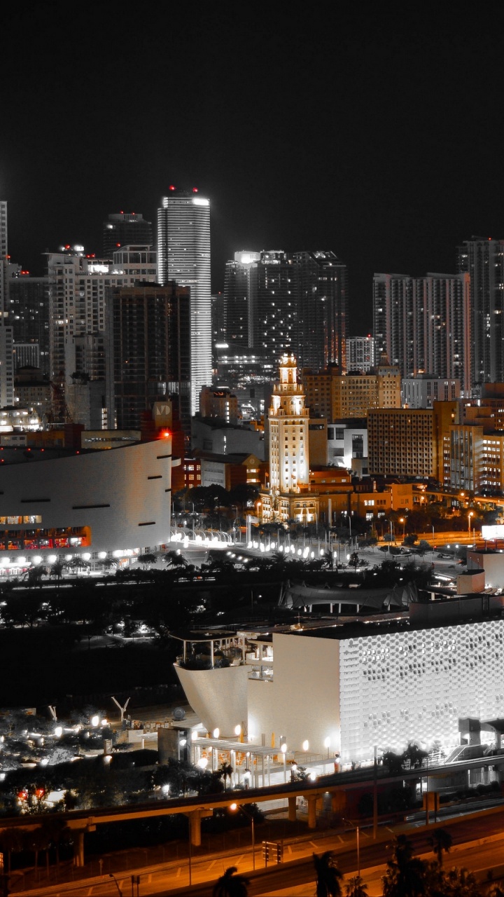City With High Rise Buildings During Night Time. Wallpaper in 720x1280 Resolution