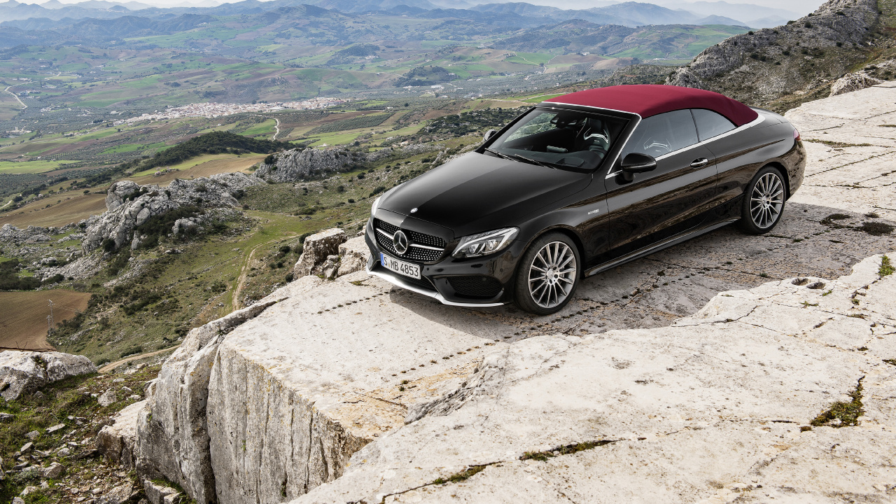 Black Mercedes Benz Coupe on Gray Rock. Wallpaper in 1280x720 Resolution