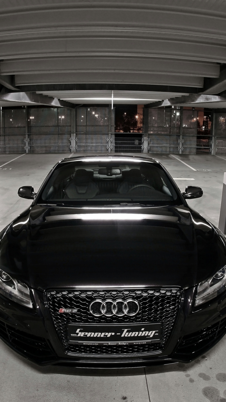 Black Porsche 911 Parked in Building. Wallpaper in 750x1334 Resolution