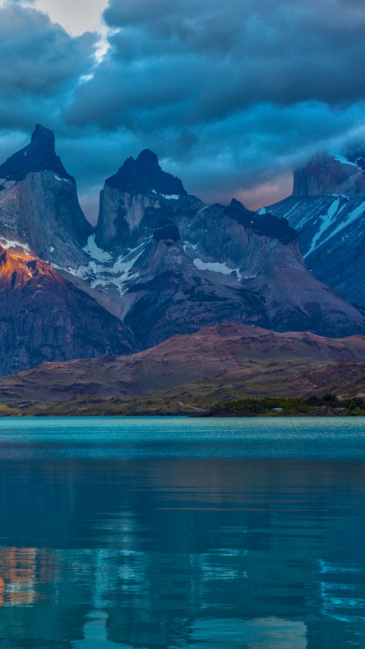 Lake Near Mountain Under Cloudy Sky During Daytime. Wallpaper in 720x1280 Resolution
