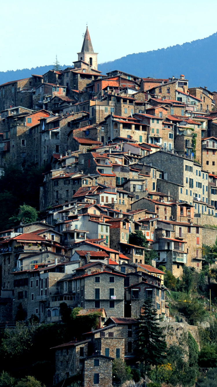 Maisons en Béton Marron et Blanc Sur la Montagne. Wallpaper in 750x1334 Resolution