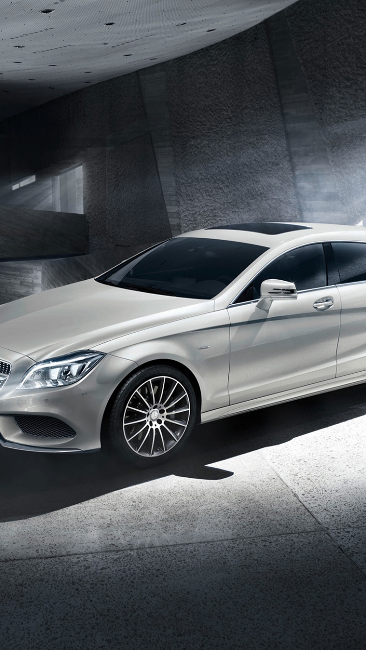 Silver Mercedes Benz Coupe Parked Beside Gray Concrete Wall. Wallpaper in 720x1280 Resolution