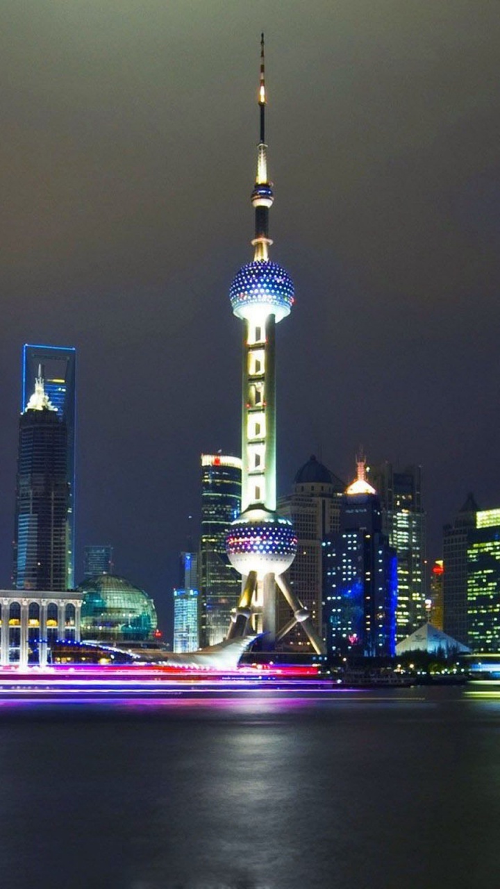 City Skyline During Night Time. Wallpaper in 720x1280 Resolution