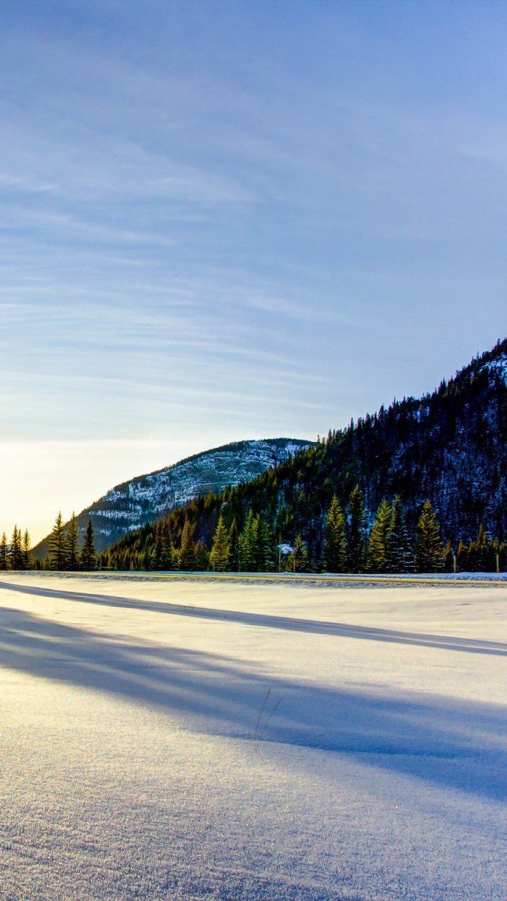 Snow Covered Road Near Trees and Mountain During Daytime. Wallpaper in 720x1280 Resolution