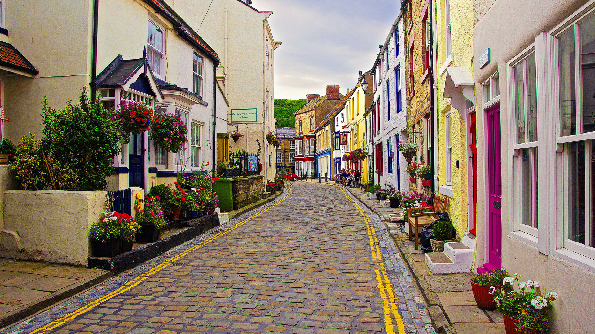 Gray Concrete Road Between Houses During Daytime. Wallpaper in 1920x1080 Resolution