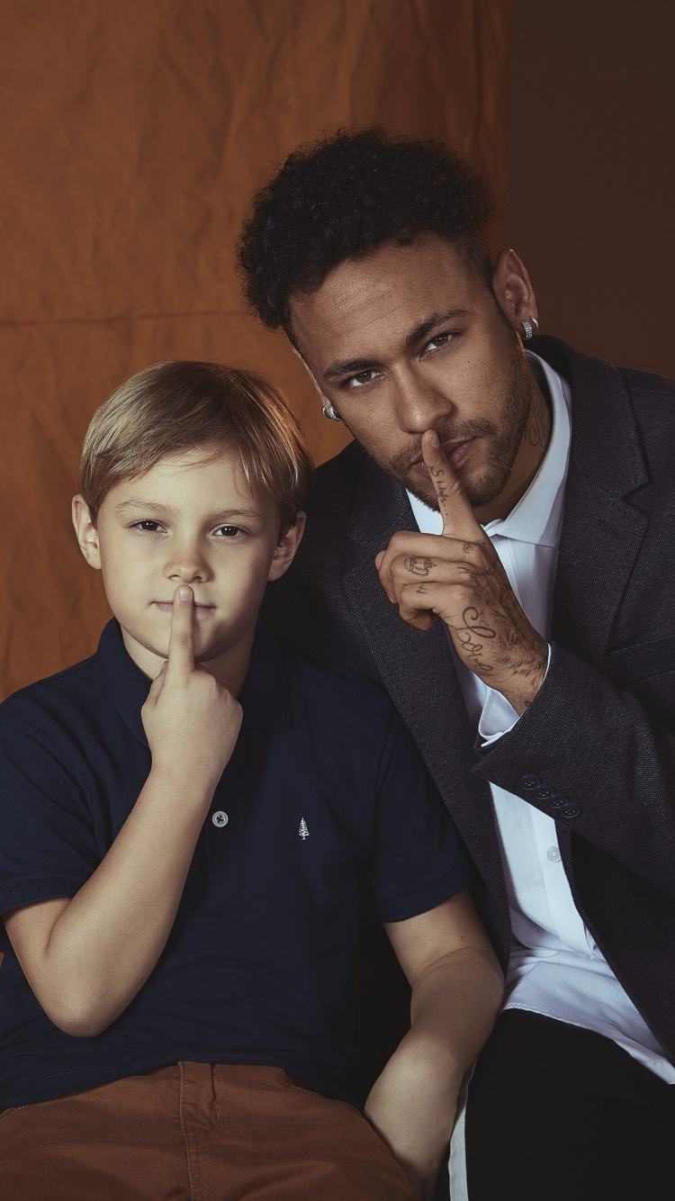 Man in Black Crew Neck T-shirt Sitting on Black Chair. Wallpaper in 750x1334 Resolution