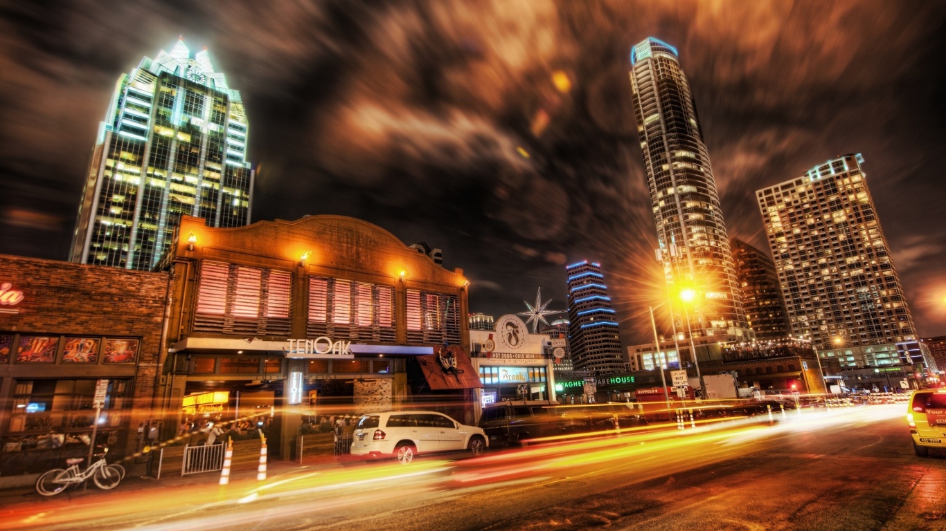 Cars on Road Near High Rise Buildings During Night Time. Wallpaper in 1366x768 Resolution