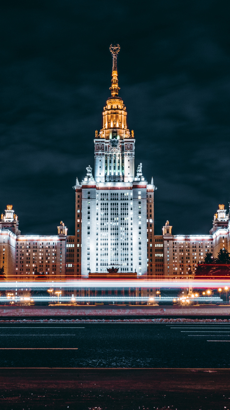 Photographie en Accéléré Des Toits de la Ville Pendant la Nuit. Wallpaper in 750x1334 Resolution