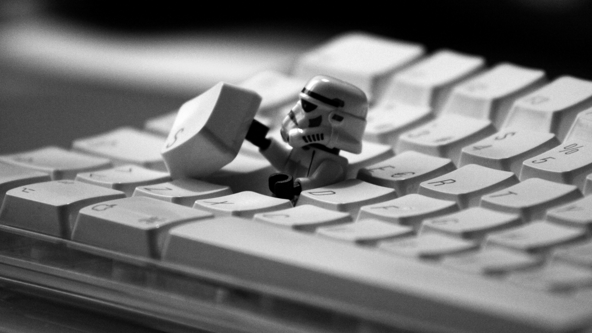 White and Black Lego Mini Figure on White Computer Keyboard. Wallpaper in 1920x1080 Resolution