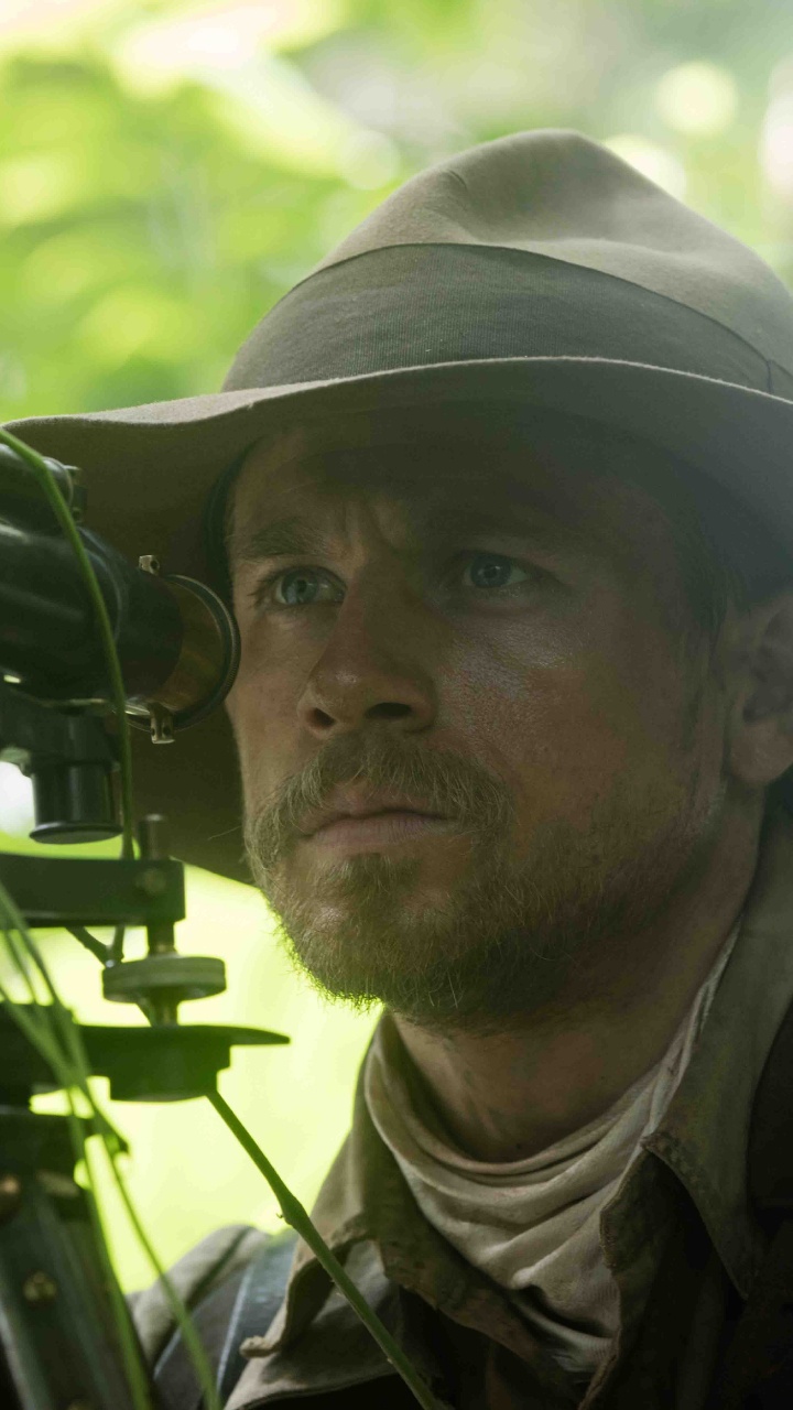 Man in Green and Brown Camouflage Uniform Holding Black Camera. Wallpaper in 720x1280 Resolution