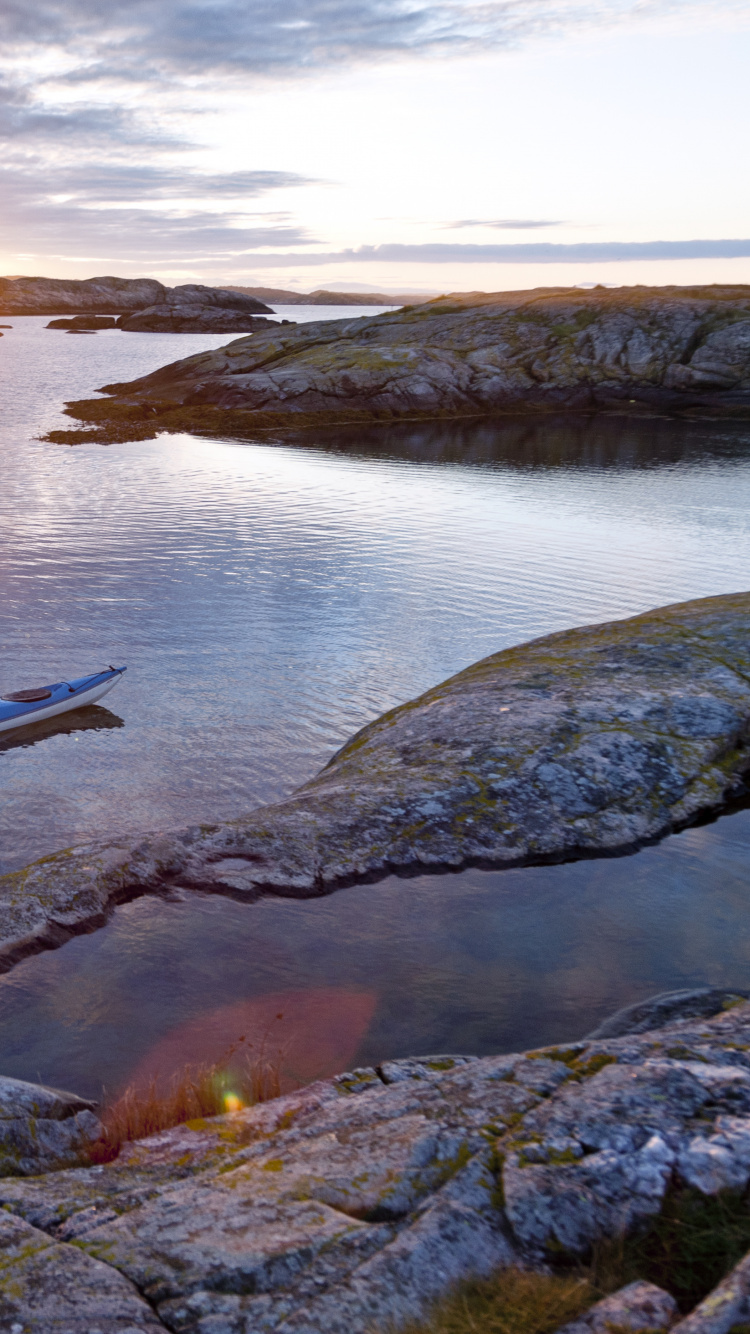 2 Men Riding on Boat During Sunset. Wallpaper in 750x1334 Resolution