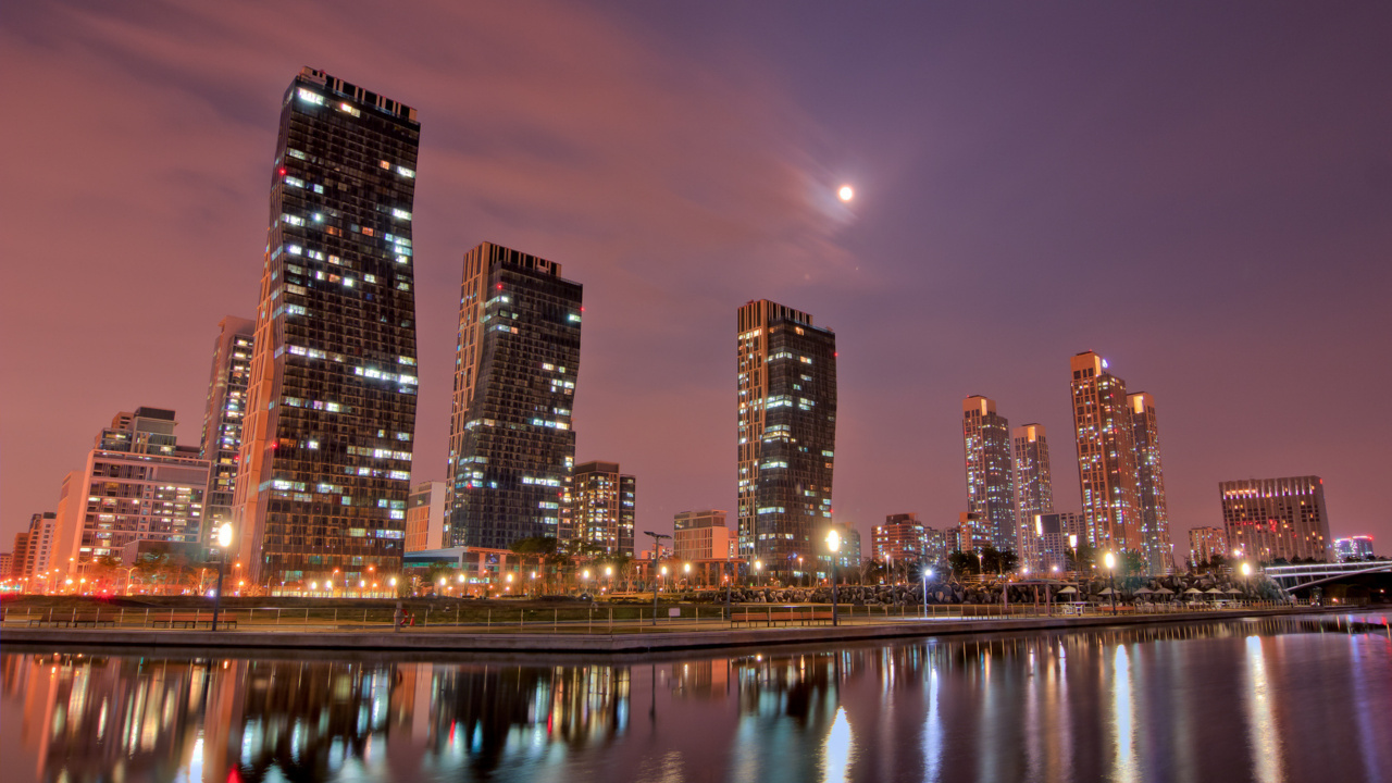 City Skyline Across Body of Water During Night Time. Wallpaper in 1280x720 Resolution