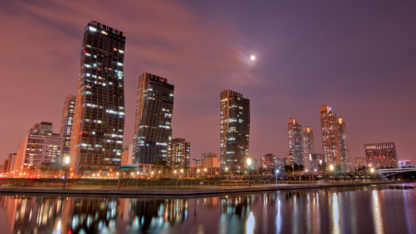 City Skyline Across Body of Water During Night Time. Wallpaper in 1366x768 Resolution