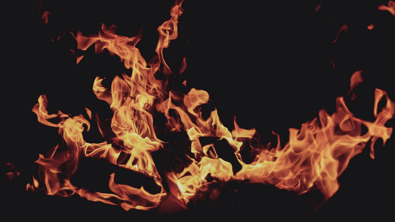 Orange Fire in Black Background. Wallpaper in 1280x720 Resolution