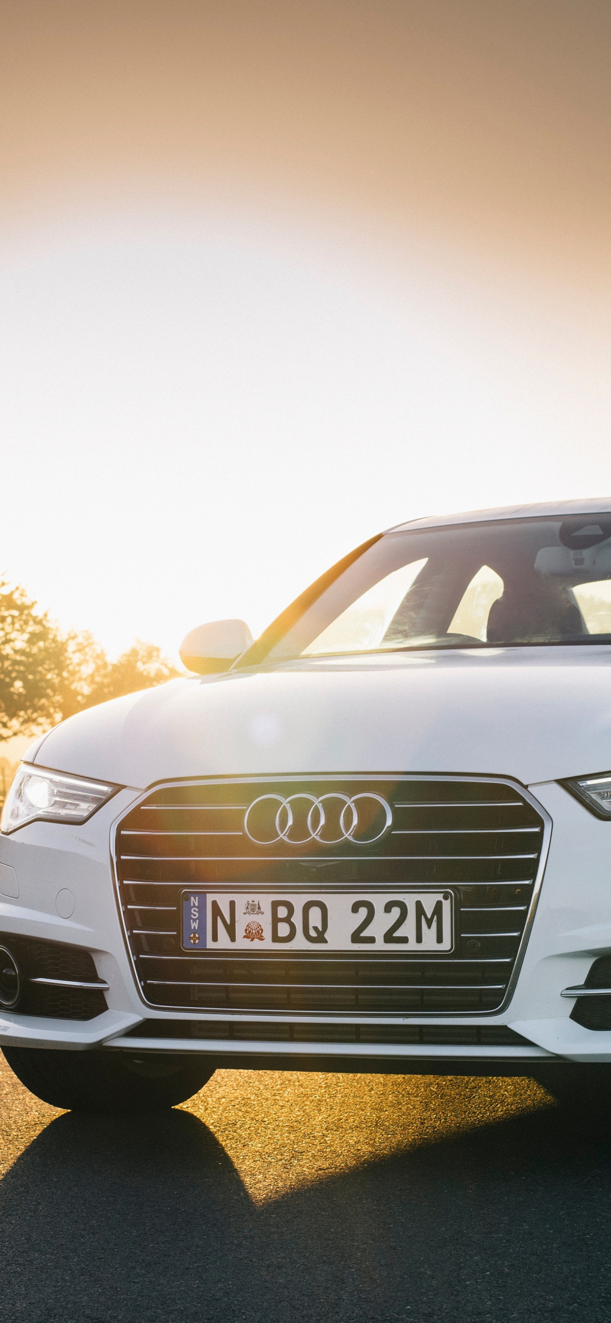 White Audi a 4 on Road During Daytime. Wallpaper in 1242x2688 Resolution
