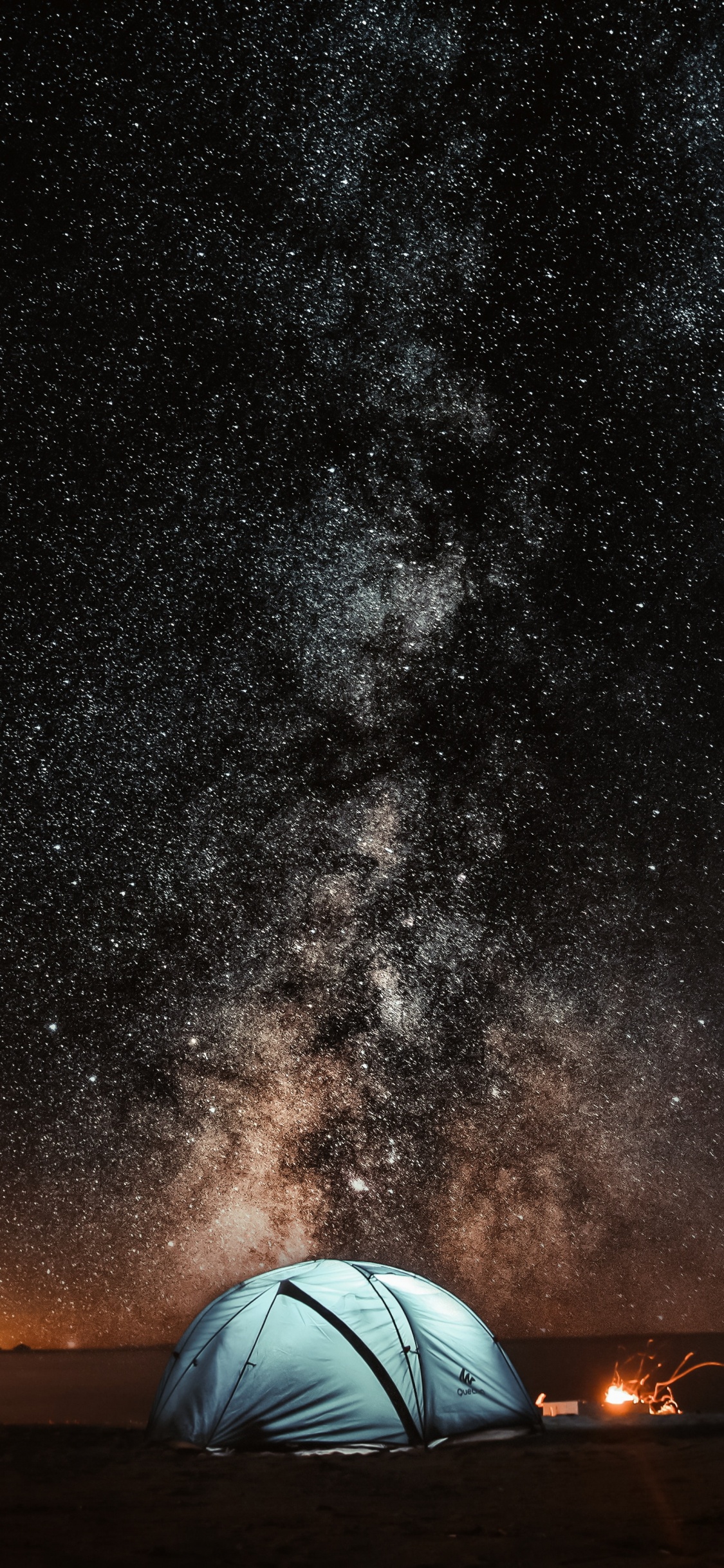 White Dome Tent Under Starry Night. Wallpaper in 1125x2436 Resolution