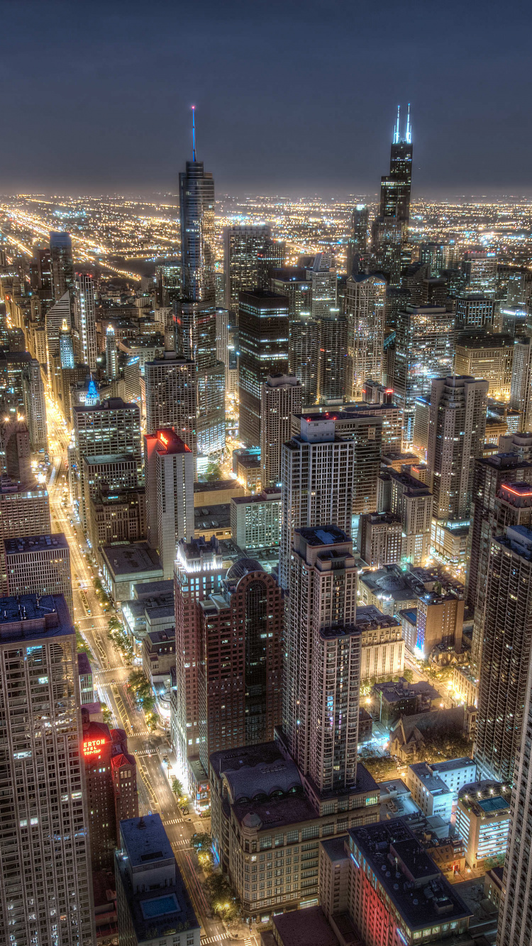 Vue Aérienne Des Bâtiments de la Ville Pendant la Nuit. Wallpaper in 750x1334 Resolution