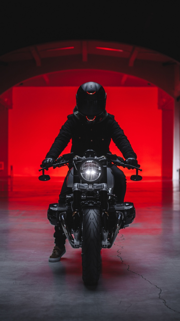 Man in Black Motorcycle Helmet Riding Motorcycle. Wallpaper in 720x1280 Resolution