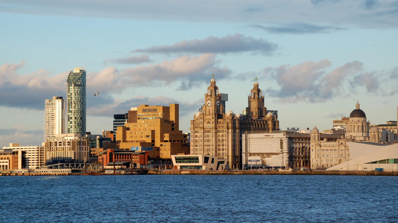 City Skyline Across Body of Water During Daytime. Wallpaper in 1366x768 Resolution